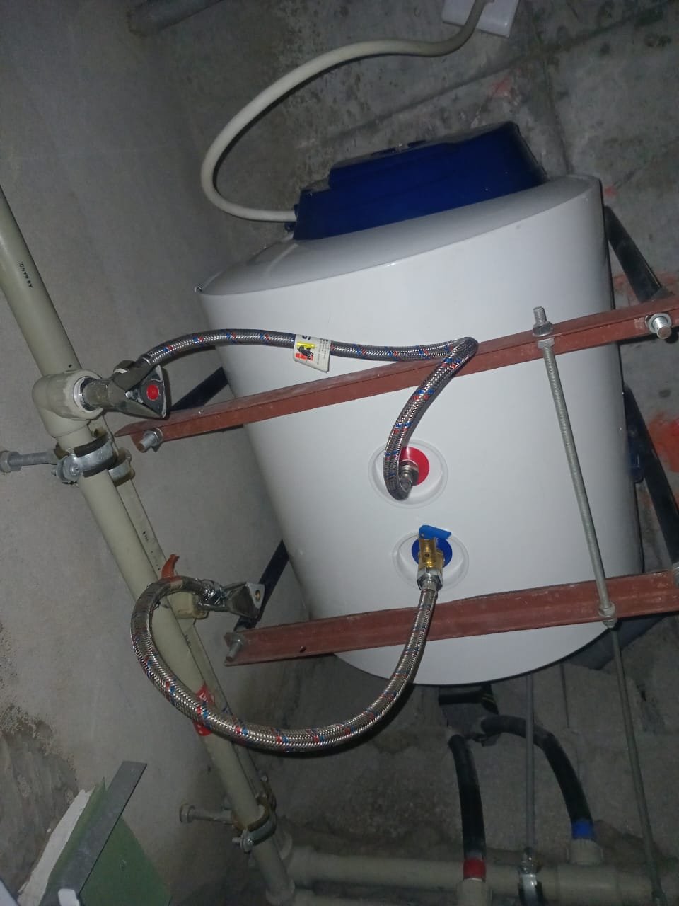 Professional ceiling-mounted water pressure booster pump installation Dubai